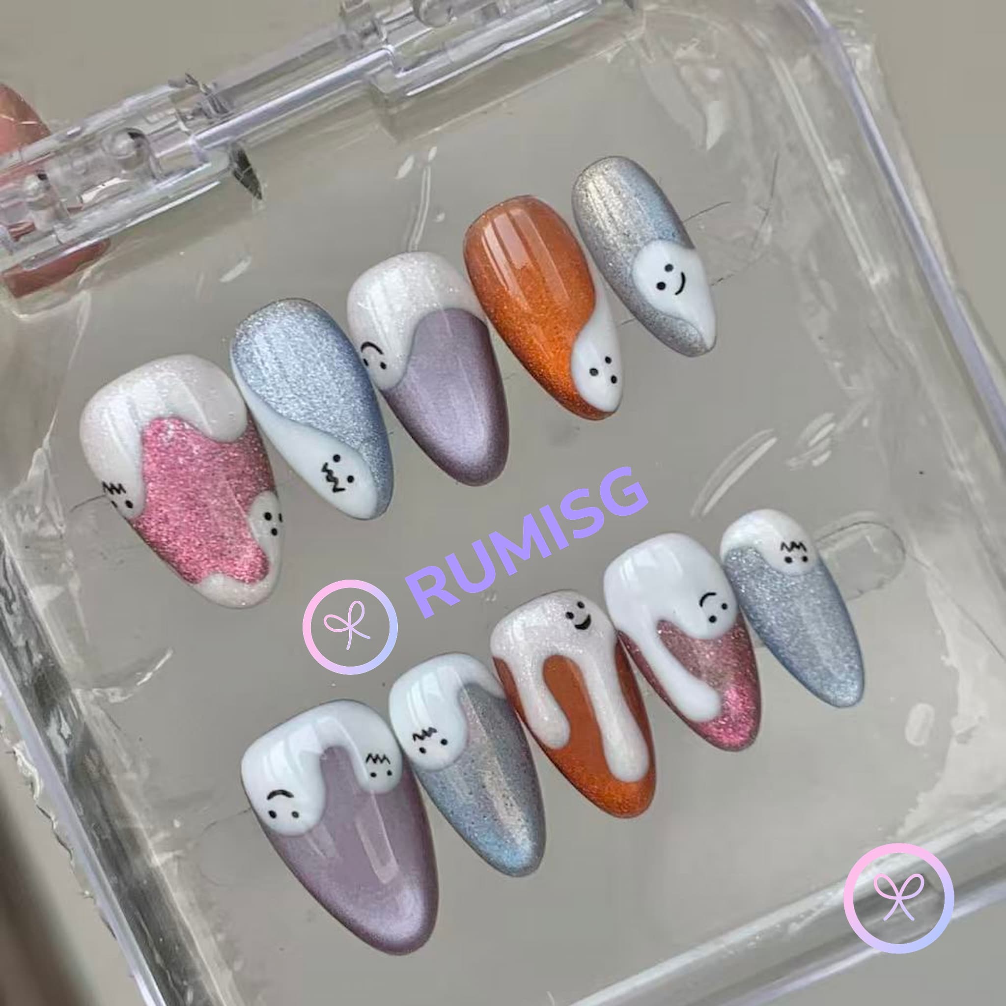 cute multicolour glossy short almond press on nails with drip motif and smiley face
