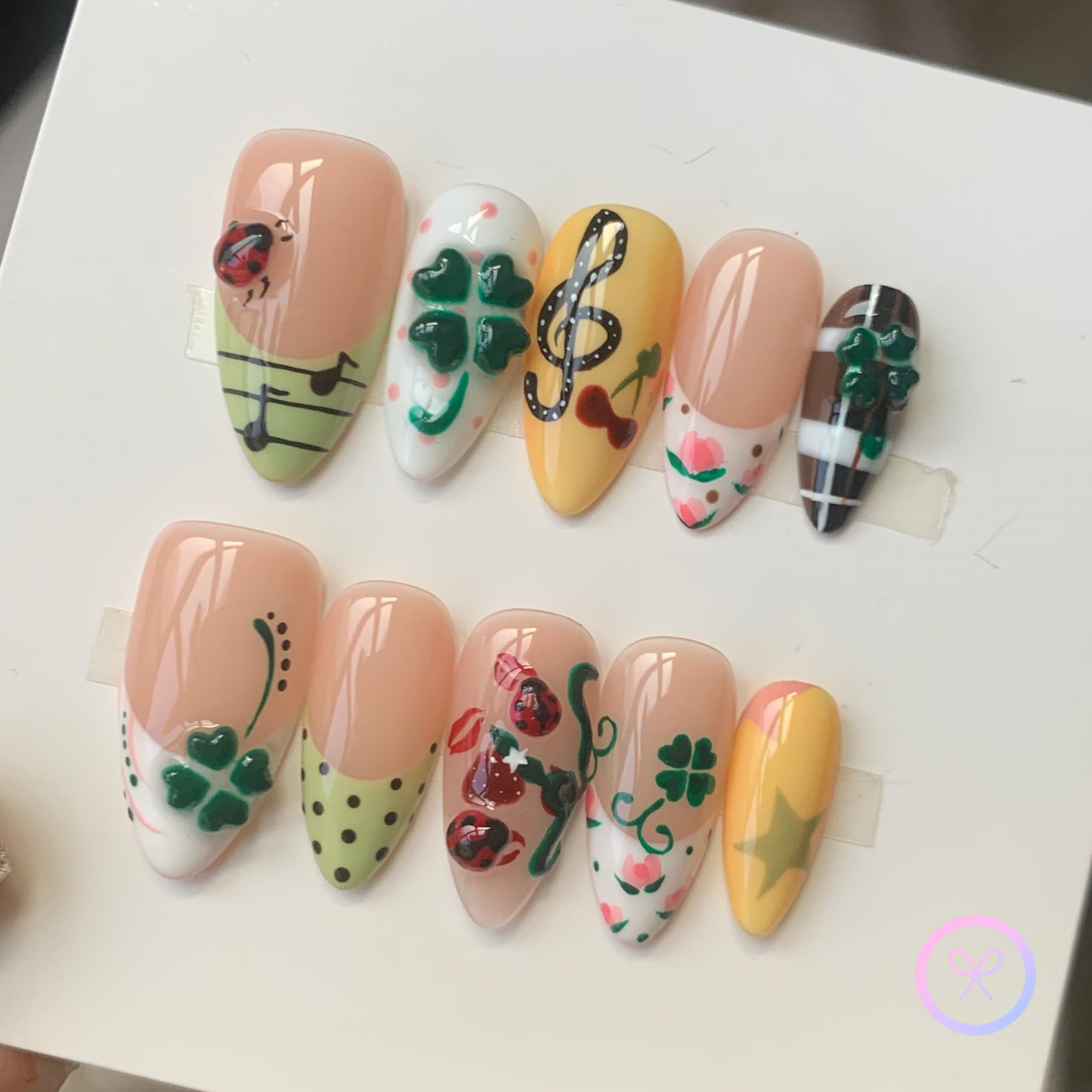 cute nude glossy medium almond press on nails with st patrick theme design
