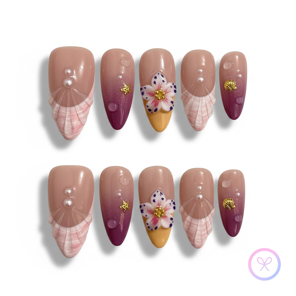 oceanic nude glossy medium almond press on nails with seashell motifs and 3d flowers