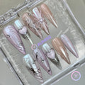 y2k pink iridescent long stiletto press on nails with embossed heart and star burst