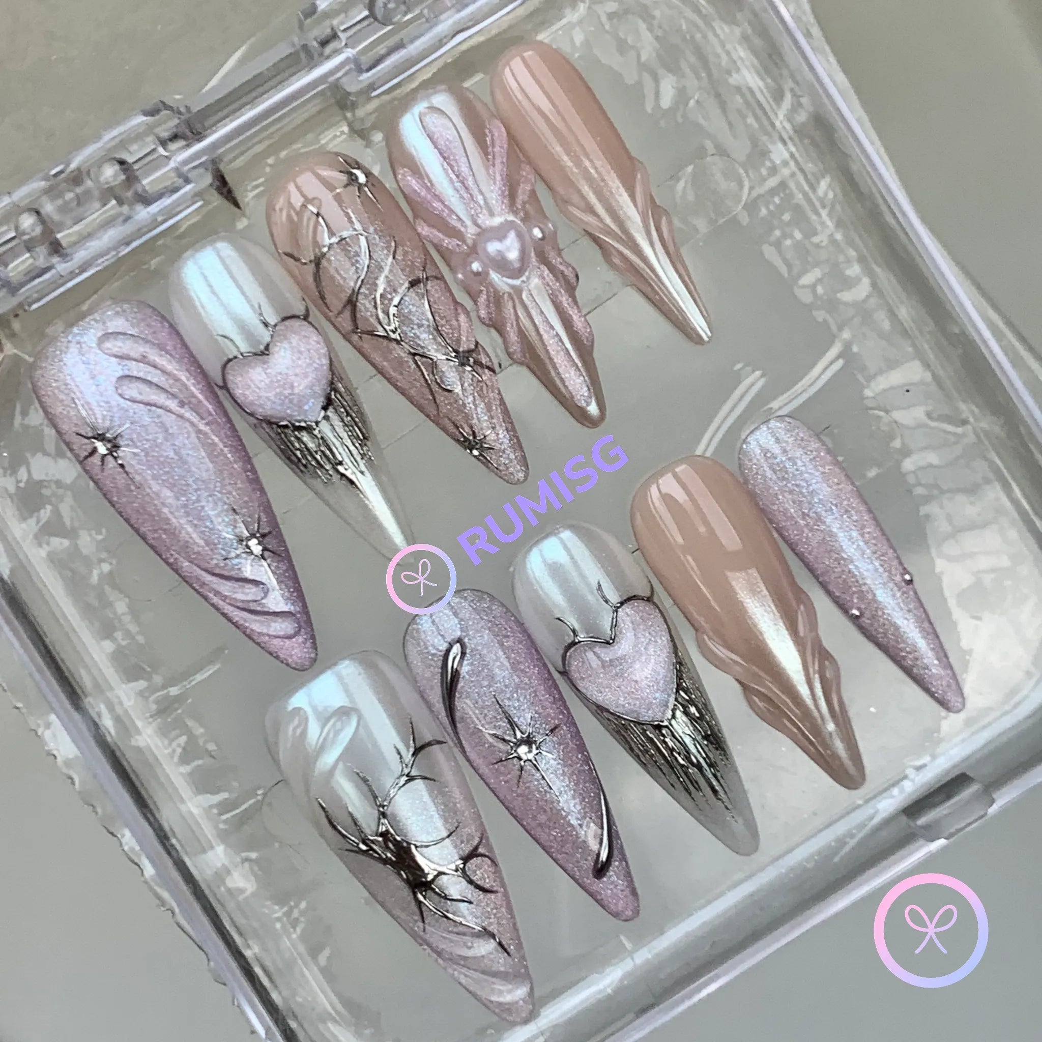 y2k pink iridescent long stiletto press on nails with embossed heart and star burst