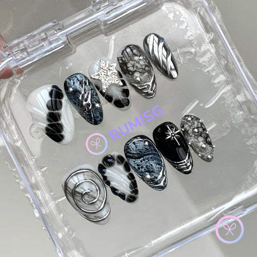 goth black glossy short almond press on nails with bloom scales and chrome swirls