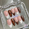 animal print nude glossy medium almond press on nails with tortoiseshell and gold beads