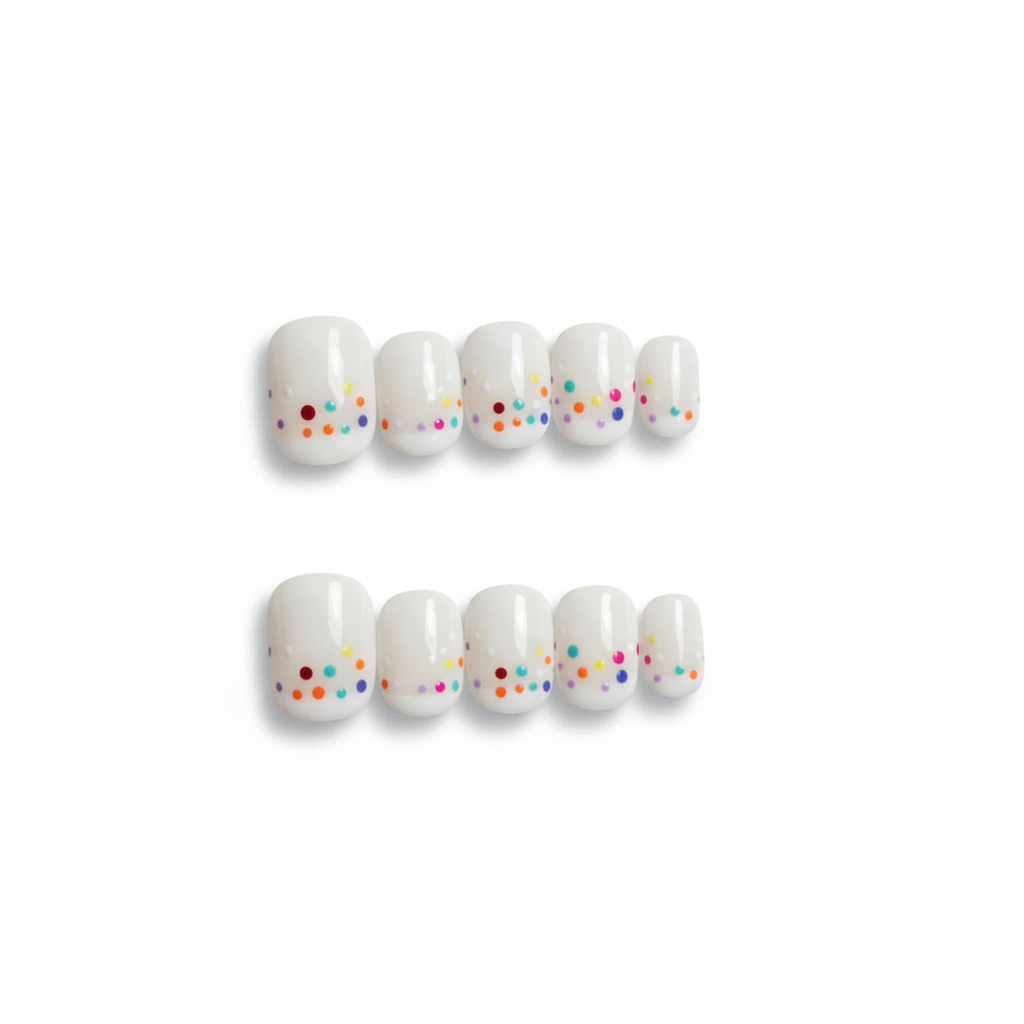 cute white glossy short round press on nails with confetti like dots , french tip