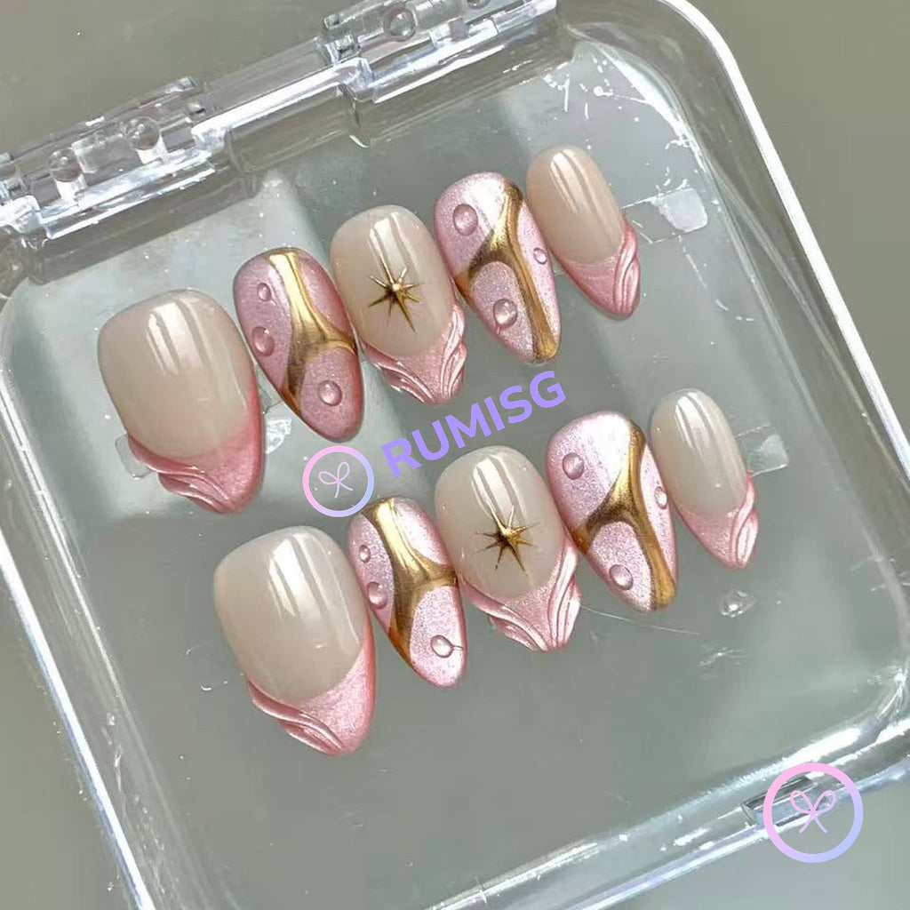 elegant pink glossy short almond press on nails with pink cat eye french tip and gold star burst