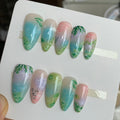 natural blue glossy medium almond press on nails with pastel colours and clouds