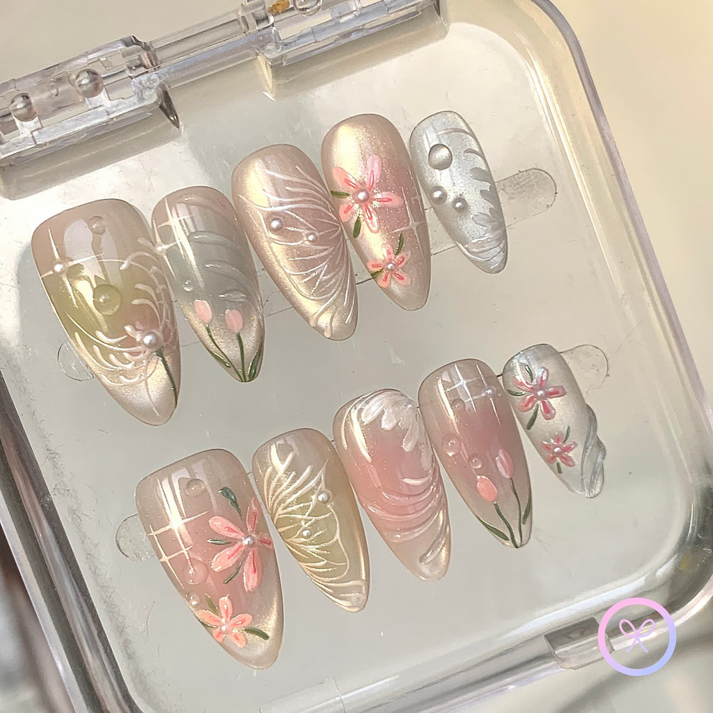 elegant pink iridescent medium almond press on nails with water lily and butterfly wings motifs