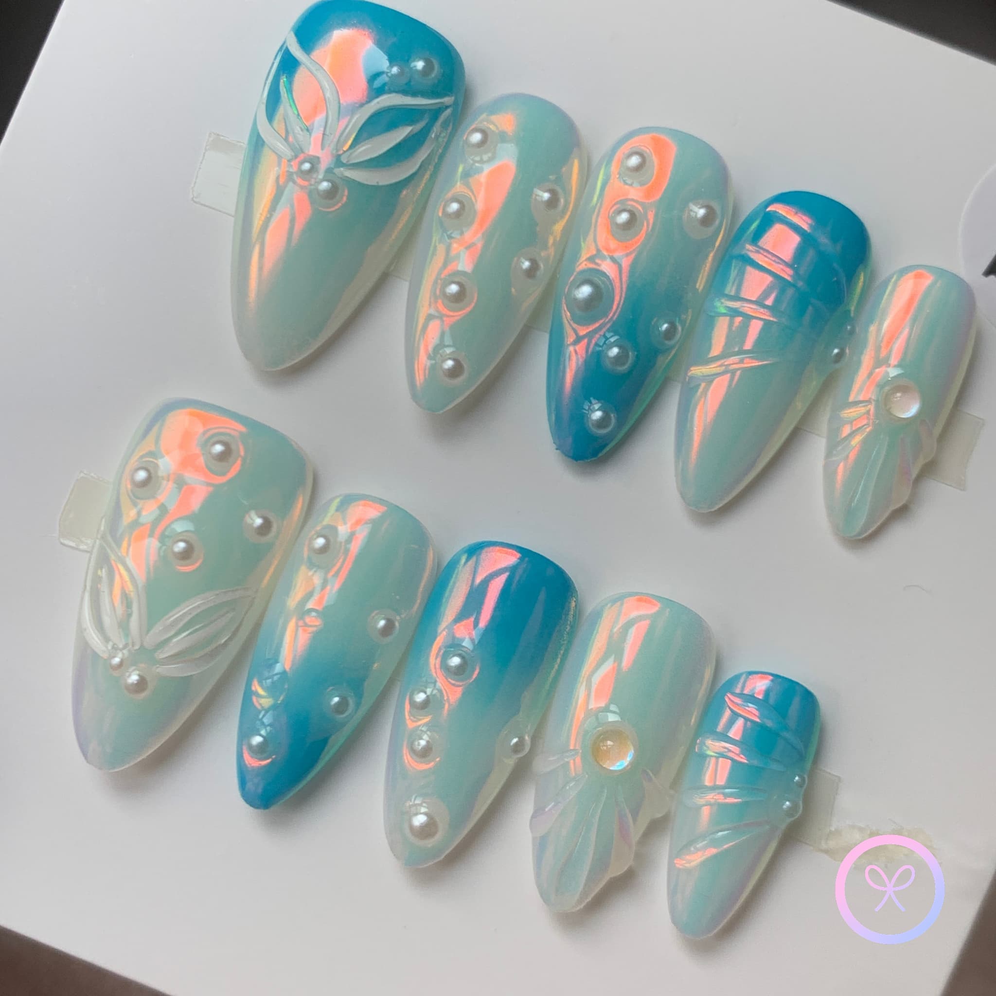 pearlcore blue pearlescent medium almond press on nails with pearls and mermaid tails