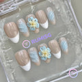 elegant nude glossy short almond press on nails with 3d flower and swirls