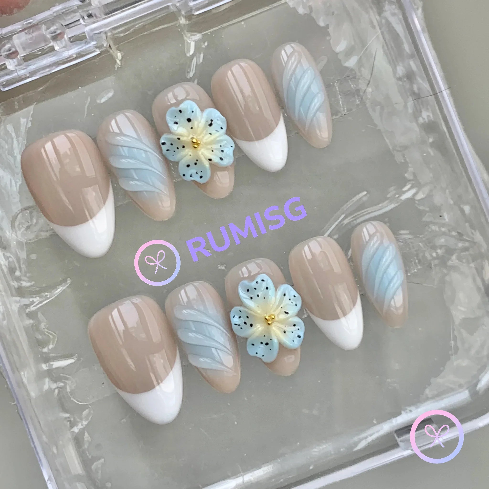 elegant nude glossy short almond press on nails with 3d flower and swirls