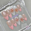 elegant nude glossy medium almond press on nails with embossed flower and pearls