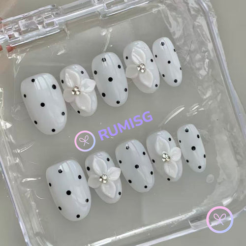elegant white glossy short oval press on nails with polka dots and 3d flower