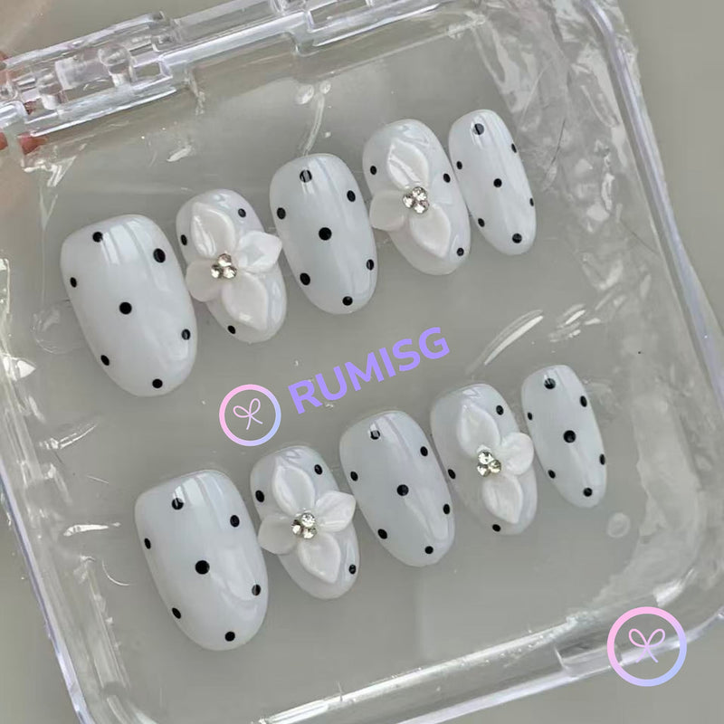 elegant white glossy short oval press on nails with polka dots and 3d flower