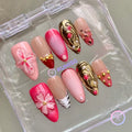 royalcore pink glossy medium almond press on nails with gold filigree and 3d flower