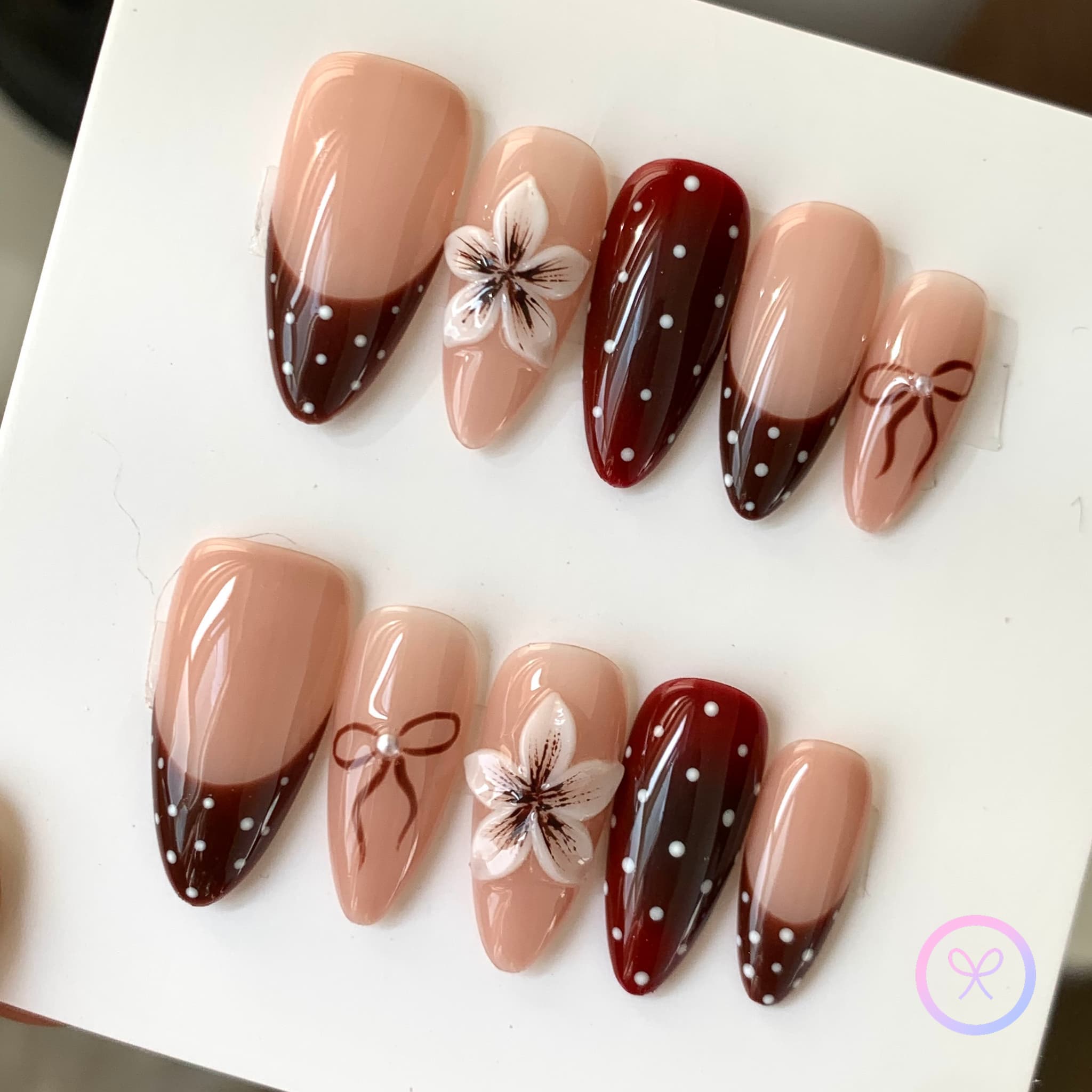 elegant nude glossy medium almond press on nails with polka dots and embossed flowers
