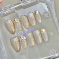 elegant nude glossy short almond press on nails with filigree