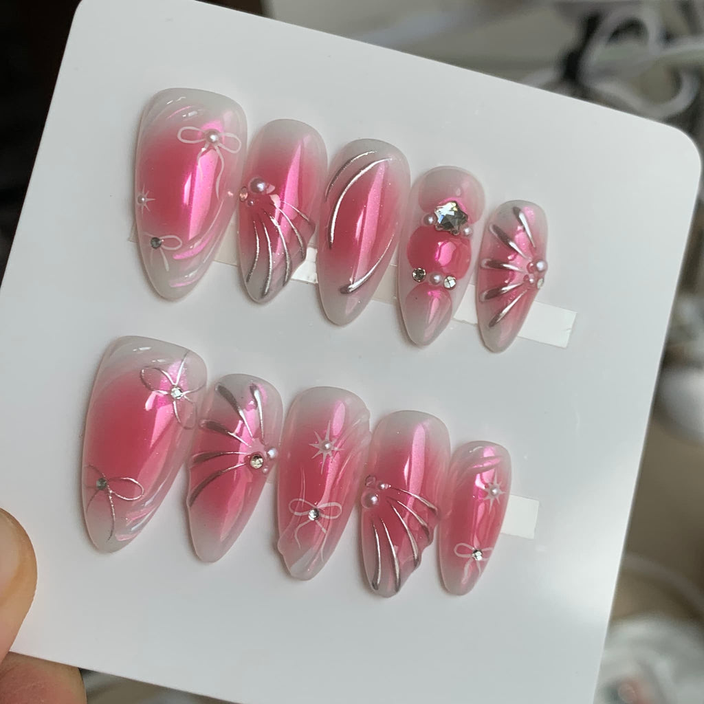 y2k pink chrome medium almond press on nails with metallic swirls and blush gradients
