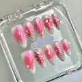  y2k pink glossy medium almond press on nails with metallic swirls and bow