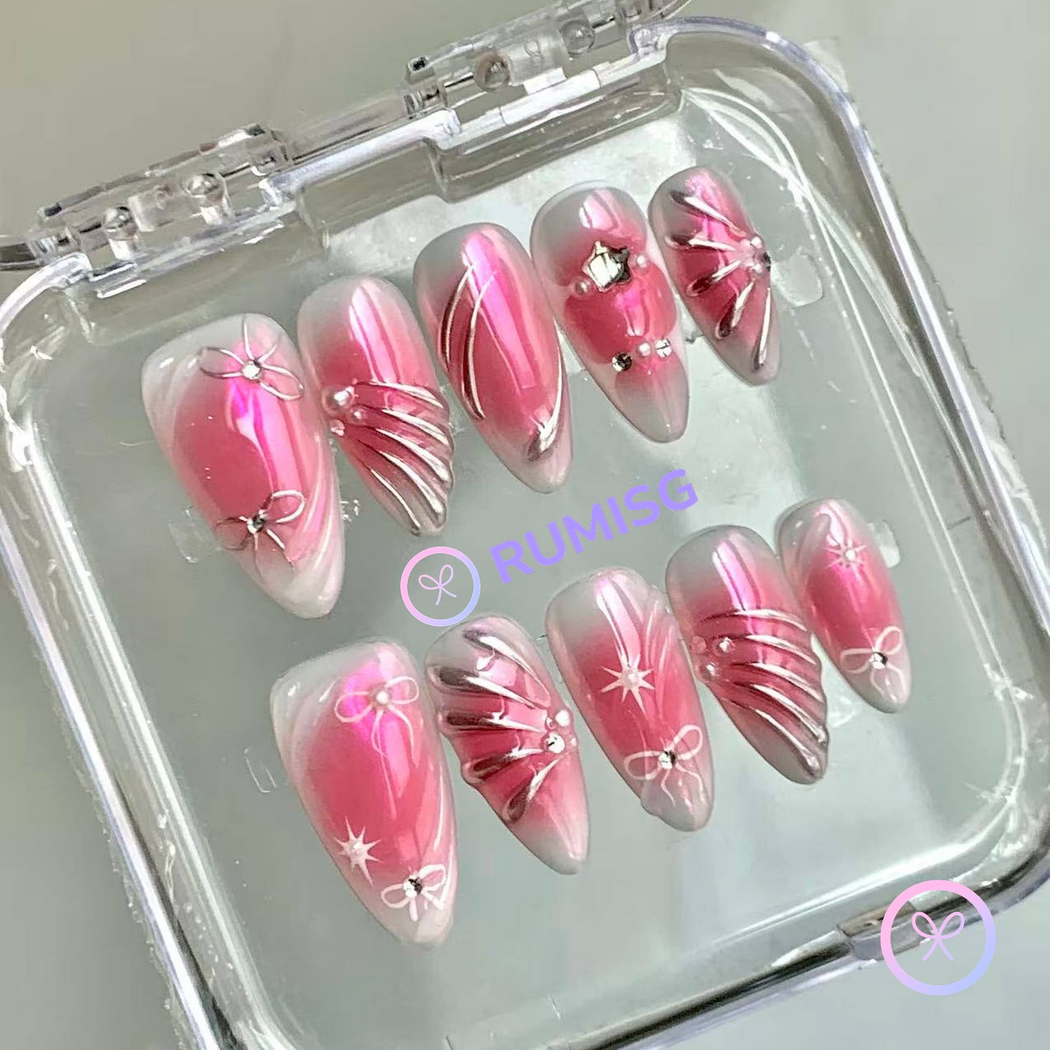  y2k pink glossy medium almond press on nails with metallic swirls and bow