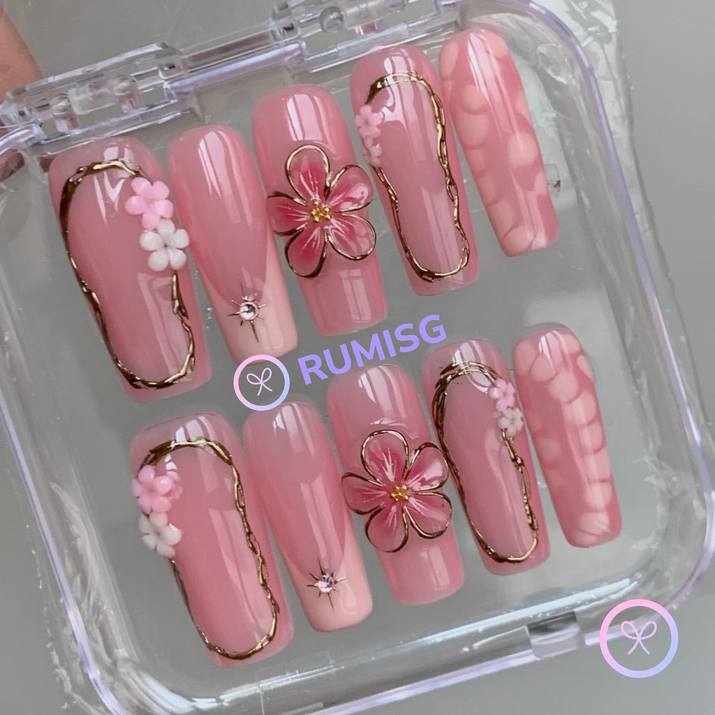 elegant pink glossy long square press on nails with embossed bloom flower and gold contour frame
