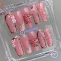 elegant pink glossy long square press on nails with embossed bloom flower and gold contour frame
