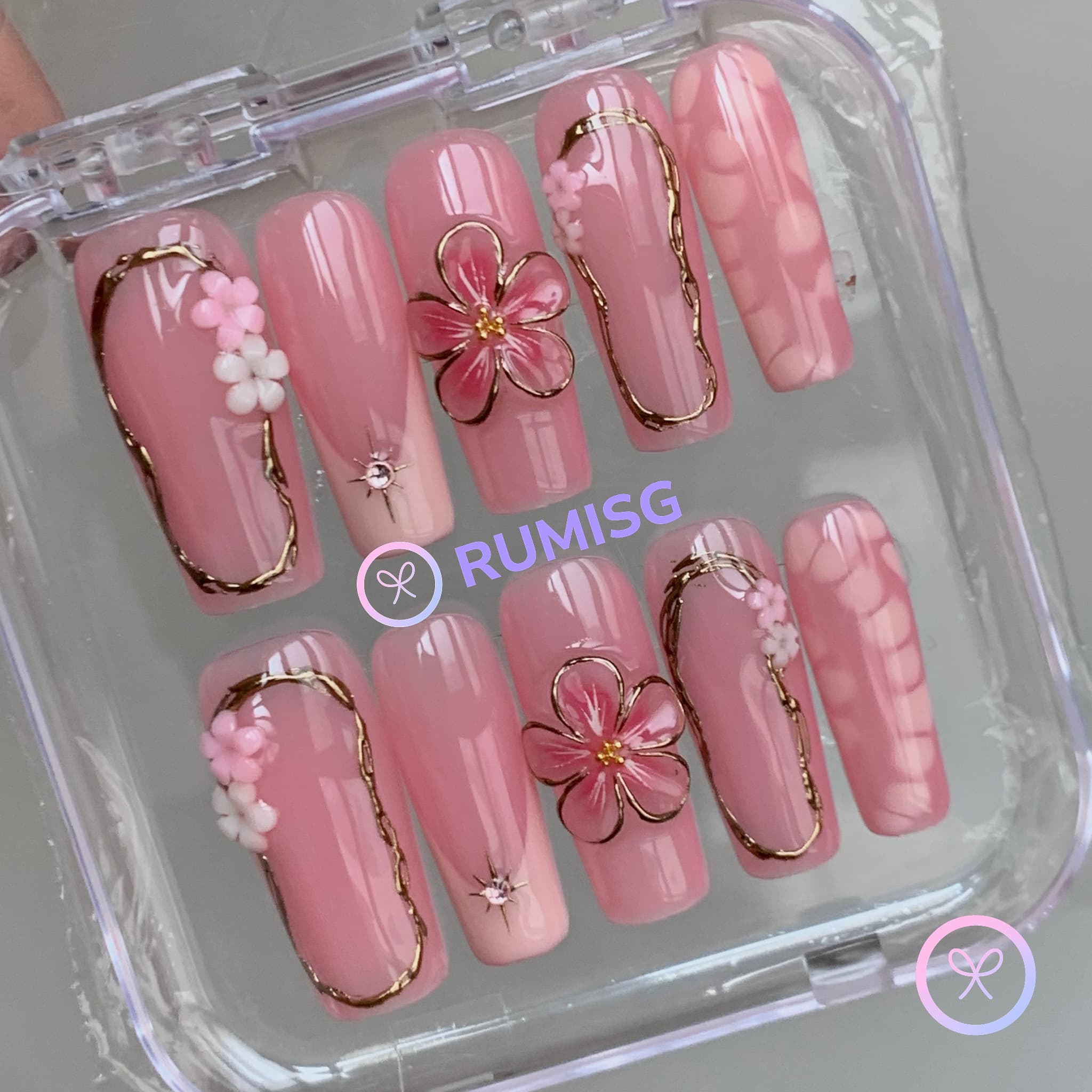 elegant pink glossy long square press on nails with embossed bloom flower and gold contour frame
