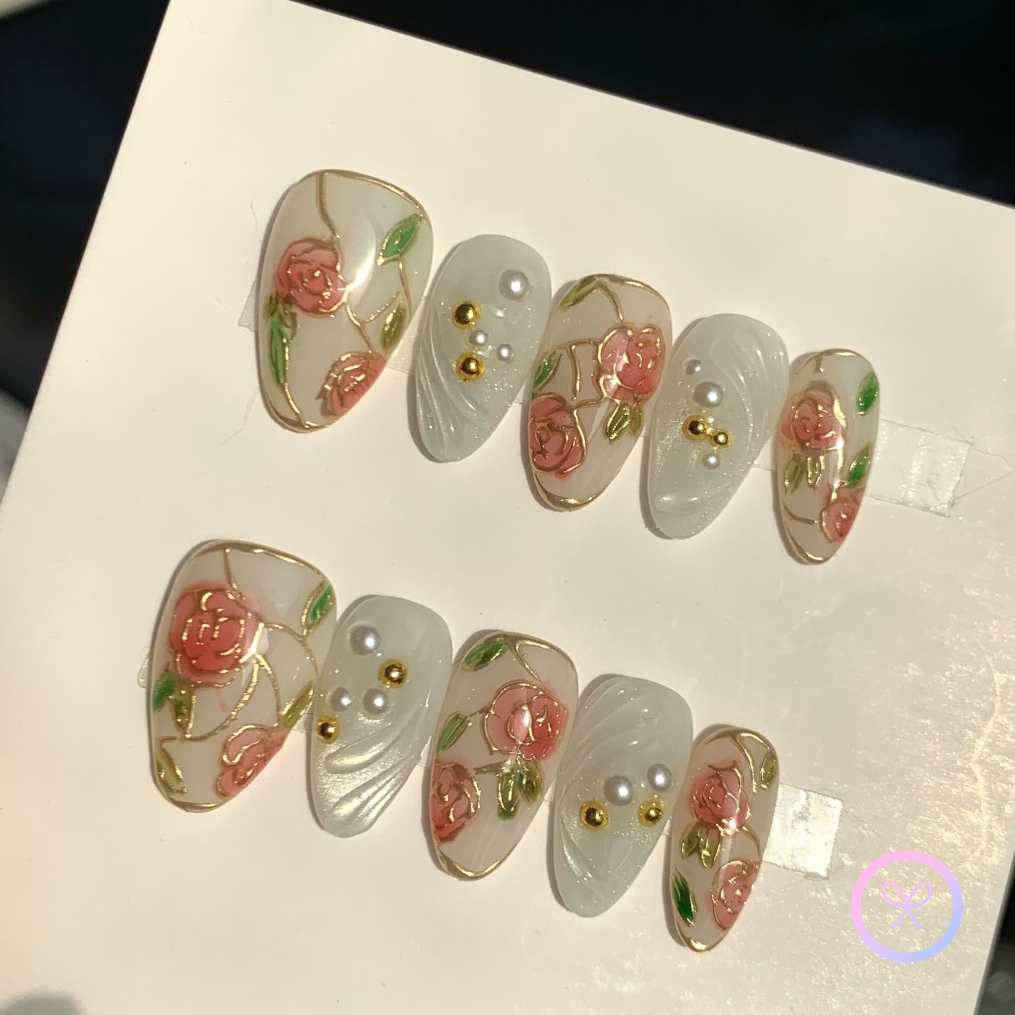 elegant white glossy short almond press on nails with gilded roses and swirls