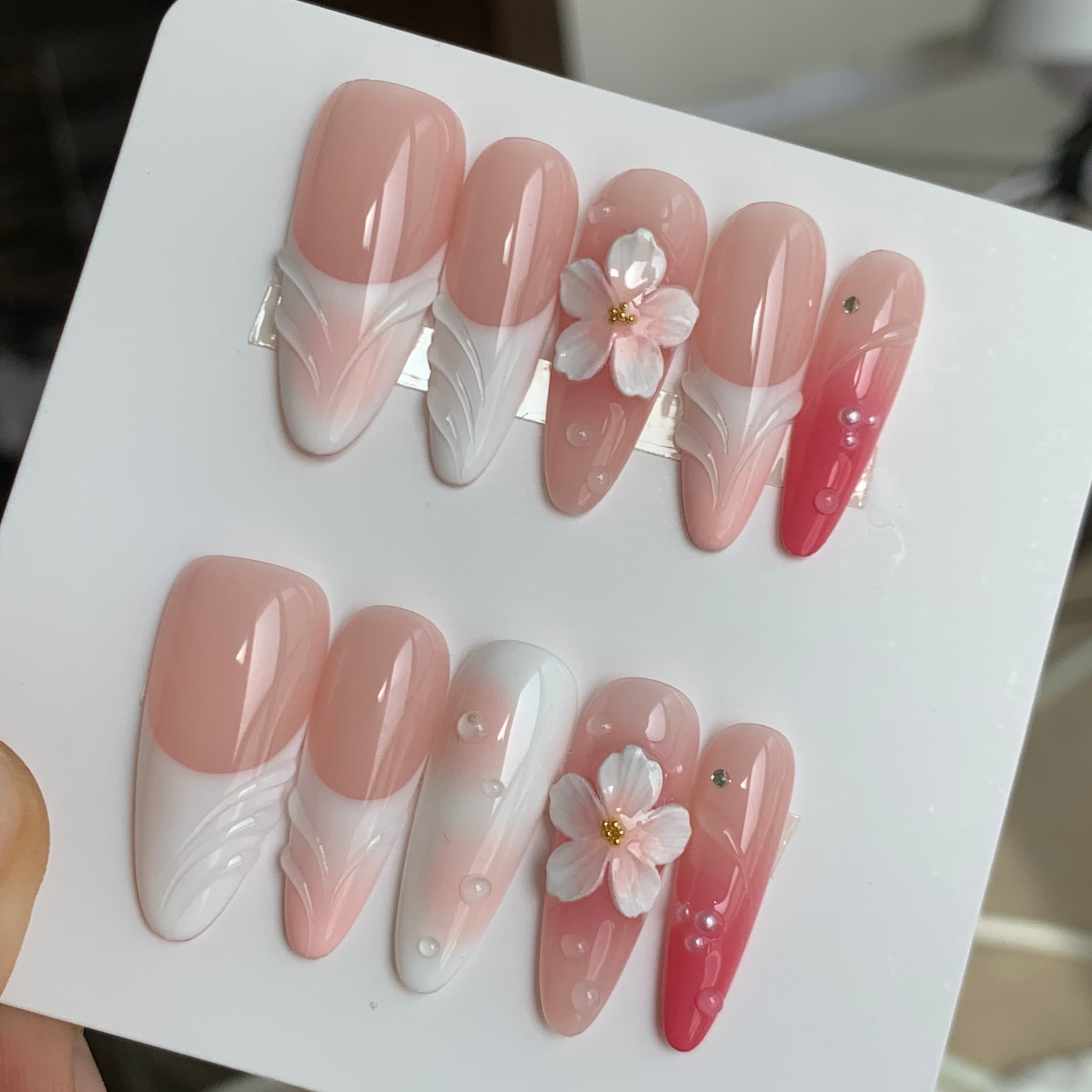 sakura nude glossy long almond press on nails with sakura motifs and blush gradients