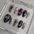 elegant black glossy short almond press on nails with sakura motifs and ink aesthetic