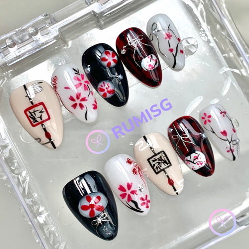 sakura black glossy short almond press on nails with sakura blossoms and ink branches