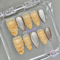 oceanic yellow glossy medium almond press on nails with sculpted seashell and pearl