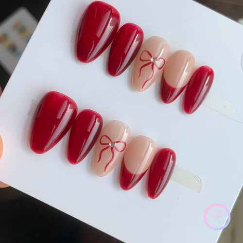 valentine red glossy short almond press on nails with ribbon motifs
