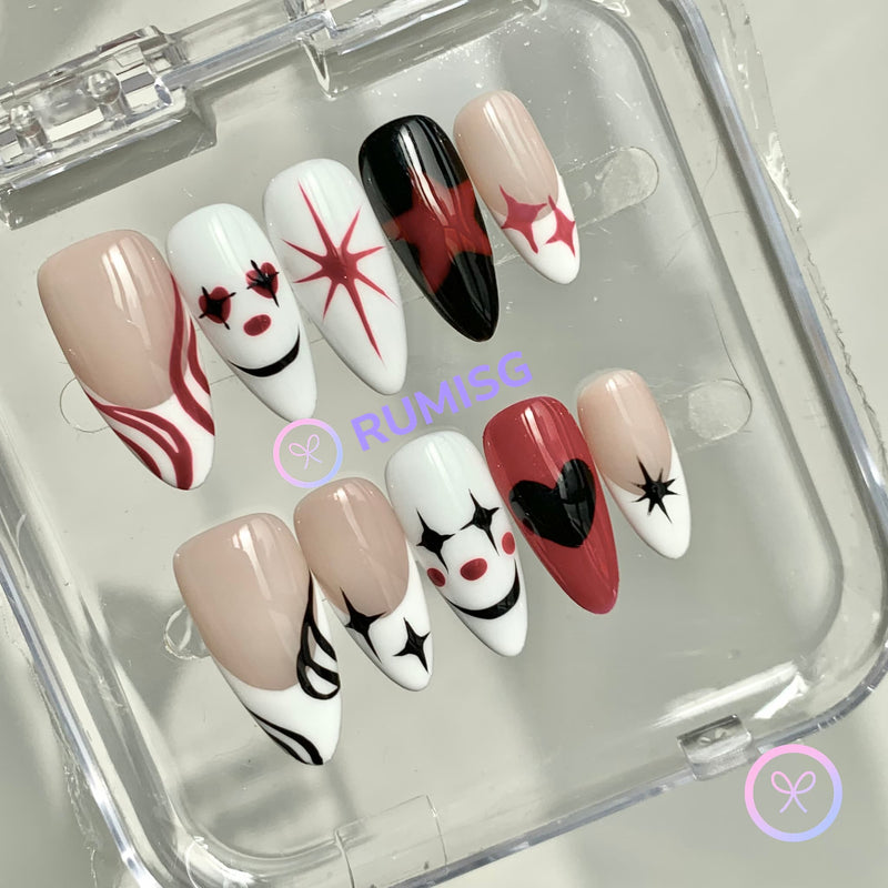 lovecore white glossy medium almond press on nails with star burst and black heart