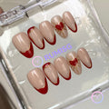 romantic red glossy short almond press on nails with heart and gold starburst linework