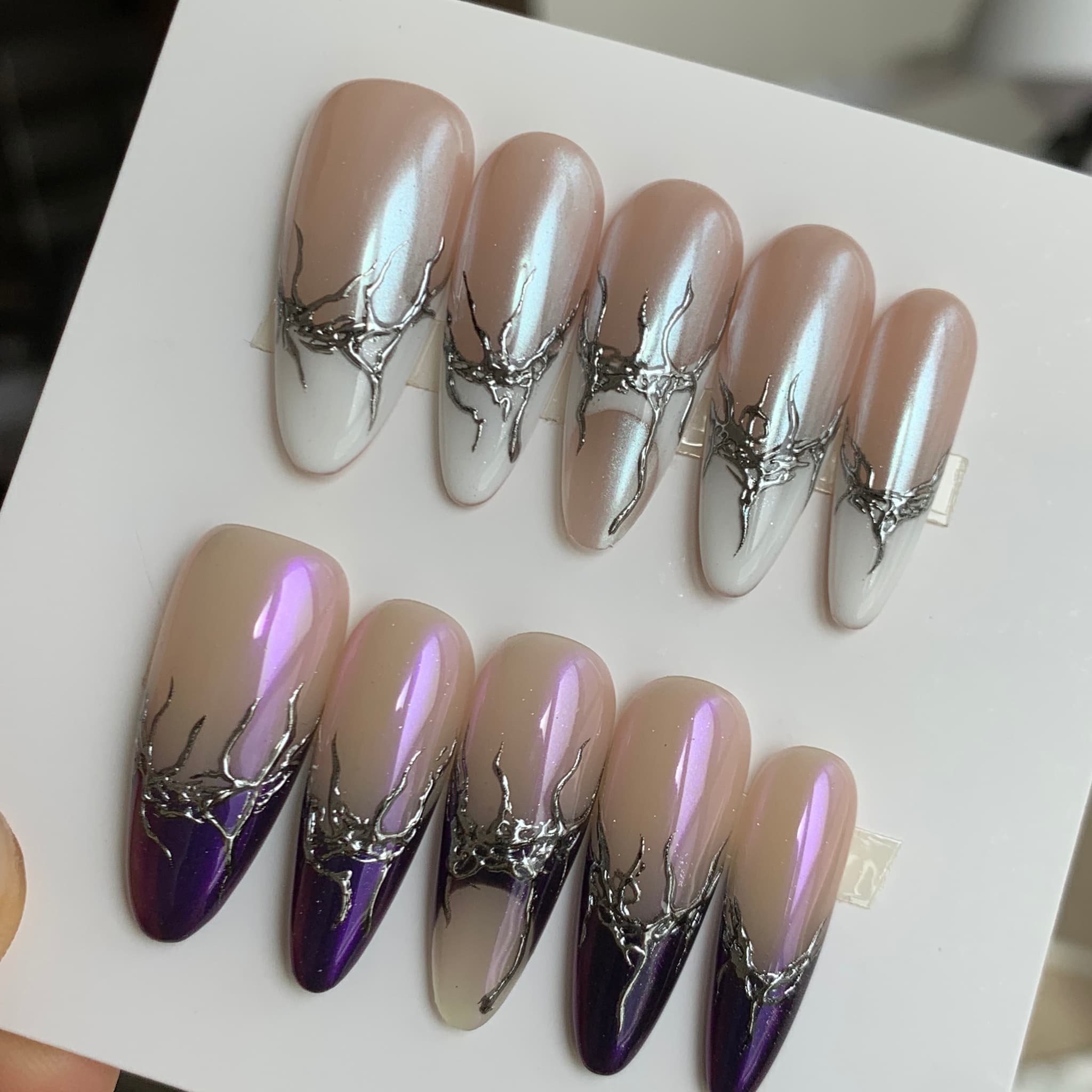 gothic white glossy medium almond press on nails with split designs and veins