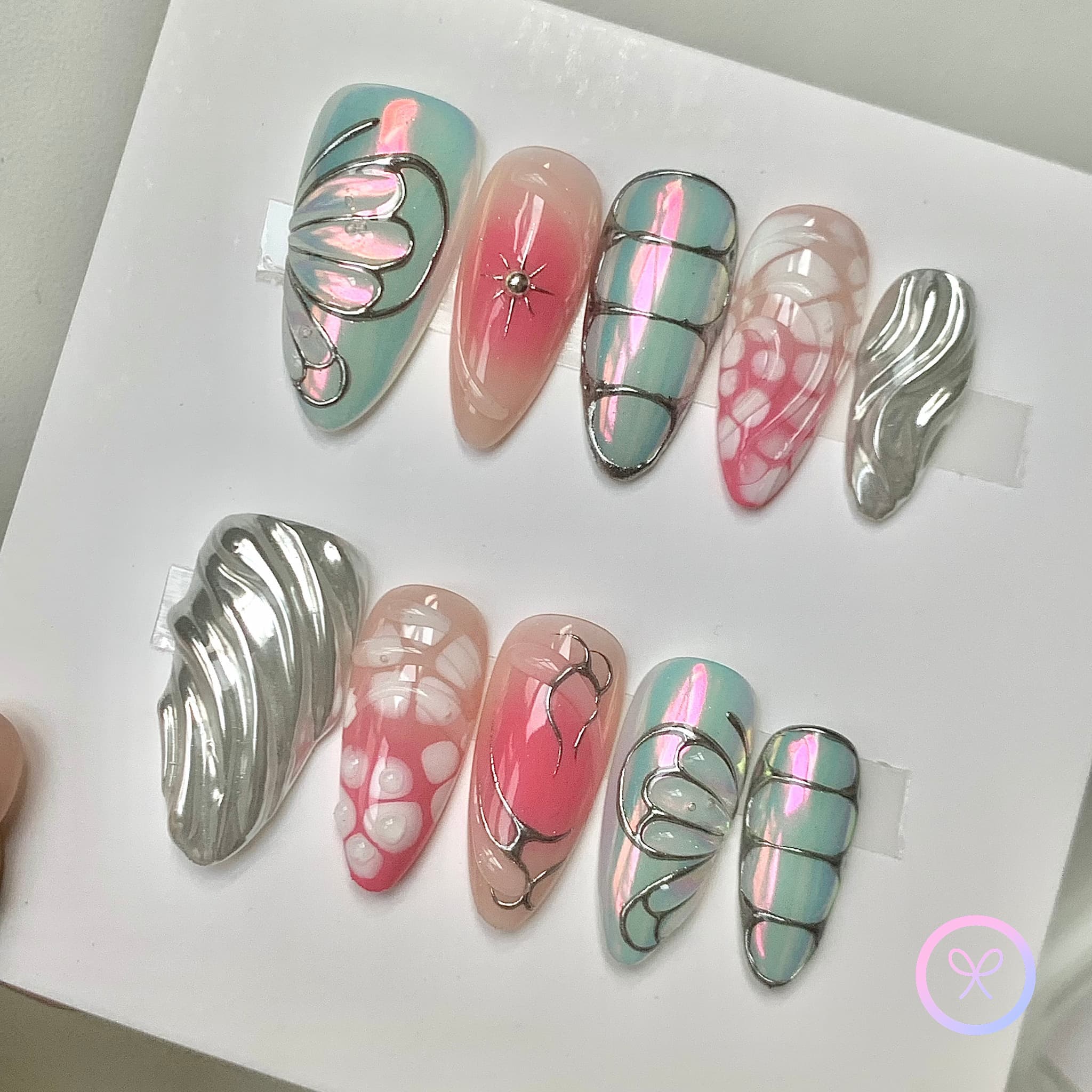 elegant pink iridescent medium almond press on nails with butterfly wings and hollow french