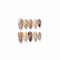 romantic nude glossy medium almond press on nails with citrus motifs and butterfly wings