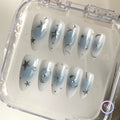 elegant sky glossy medium almond press on nails with metallic stars and swirls