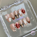 animal print nude glossy short almond press on nails with tortoiseshell and flowers