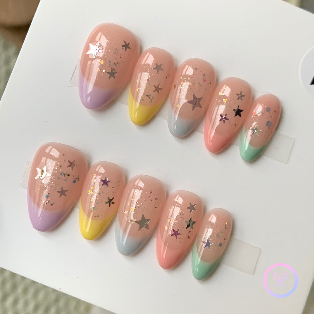 cute nude glossy short almond press on nails with star stickers and pastel french tip