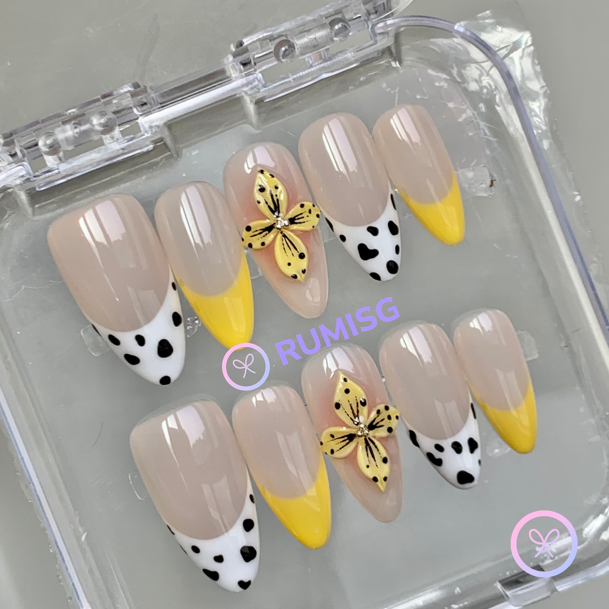 animal print nude glossy medium almond press on nails with cow print
