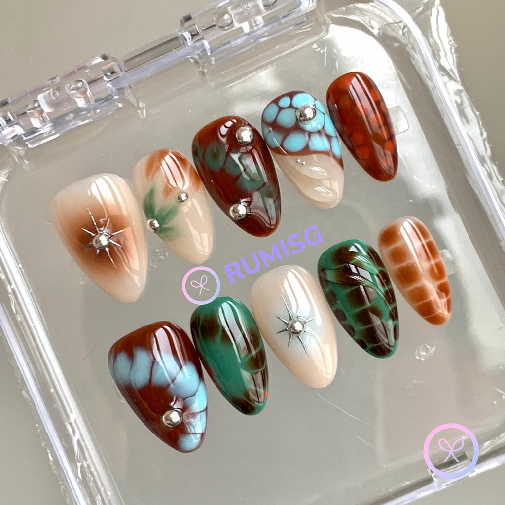 abstract brown glossy short almond press on nails with bloom scales and silver beads