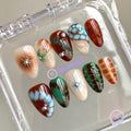 abstract brown glossy short almond press on nails with bloom scales and silver beads