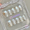pearlcore white pearlescent short square press on nails with pearl and gold foil contour detail