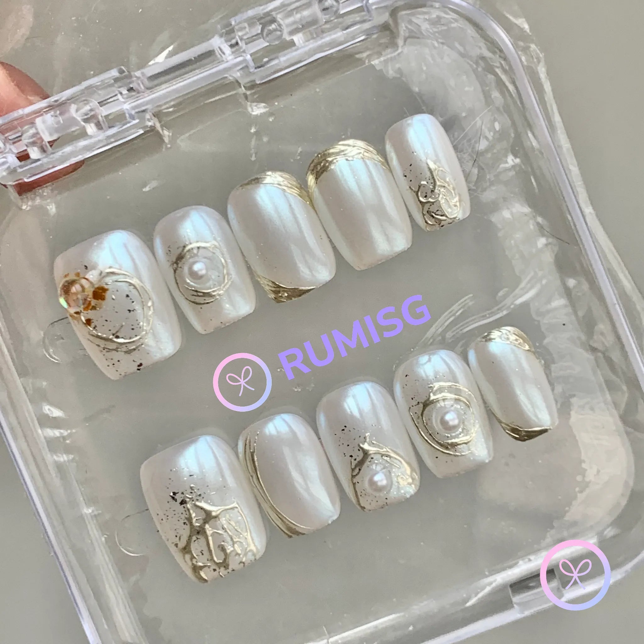 pearlcore white pearlescent short square press on nails with pearl and gold foil contour detail