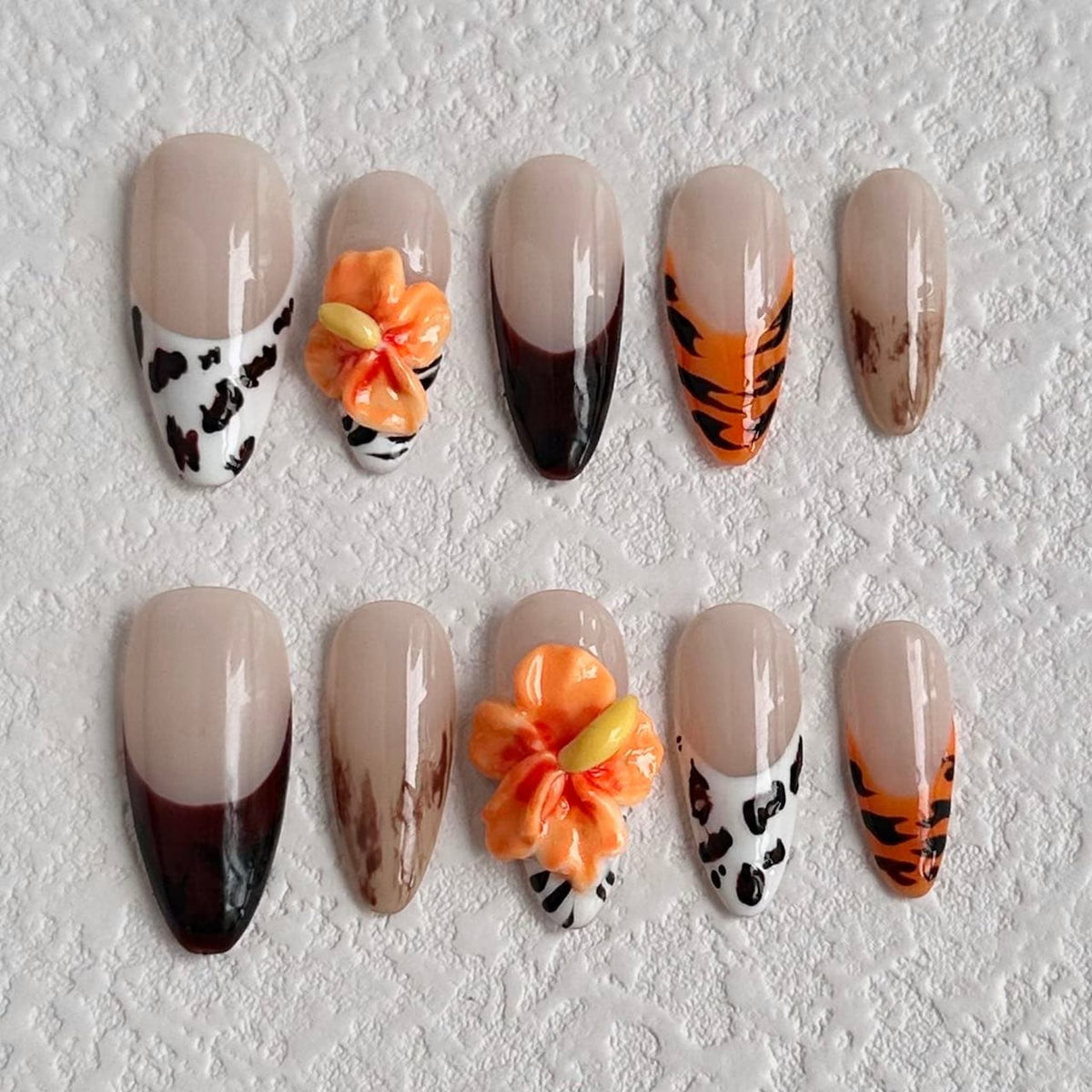 medium brown almond press on nails with animal prints