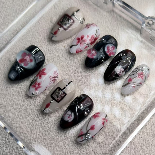 elegant black glossy short almond press on nails with sakura motifs and ink aesthetic