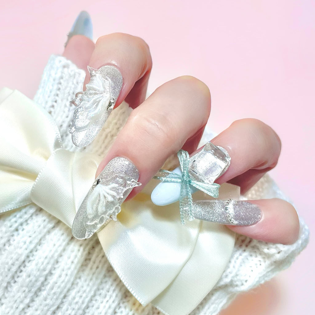 long length pale turquoise oval press on nails with butterfly wings design