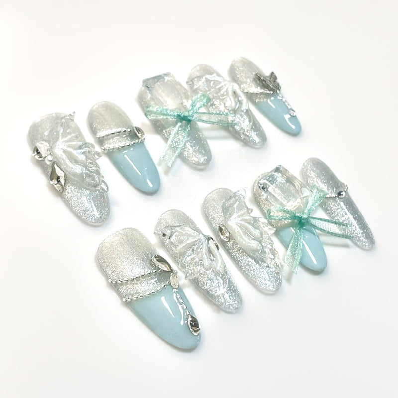 long length pale turquoise oval press on nails with butterfly wings design