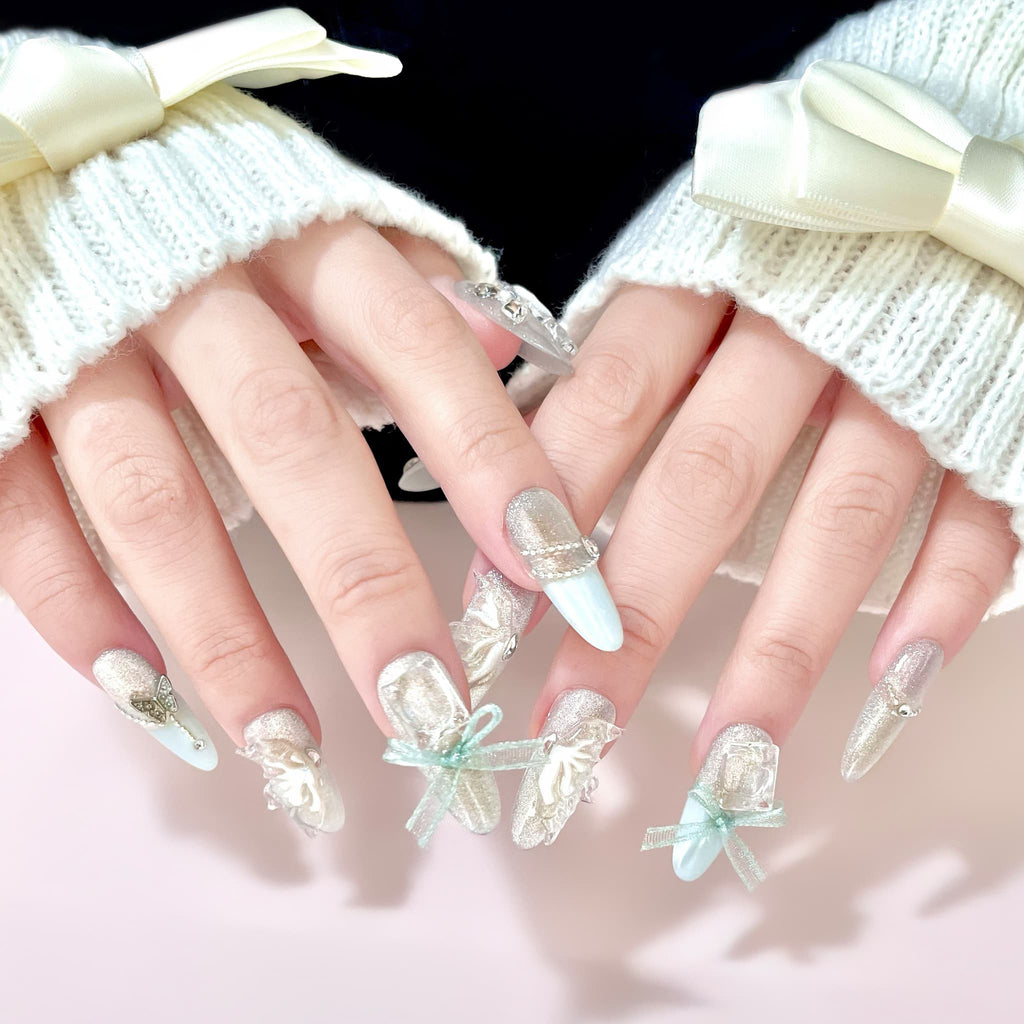 long length pale turquoise oval press on nails with butterfly wings design